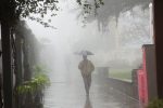 person walking in the rain